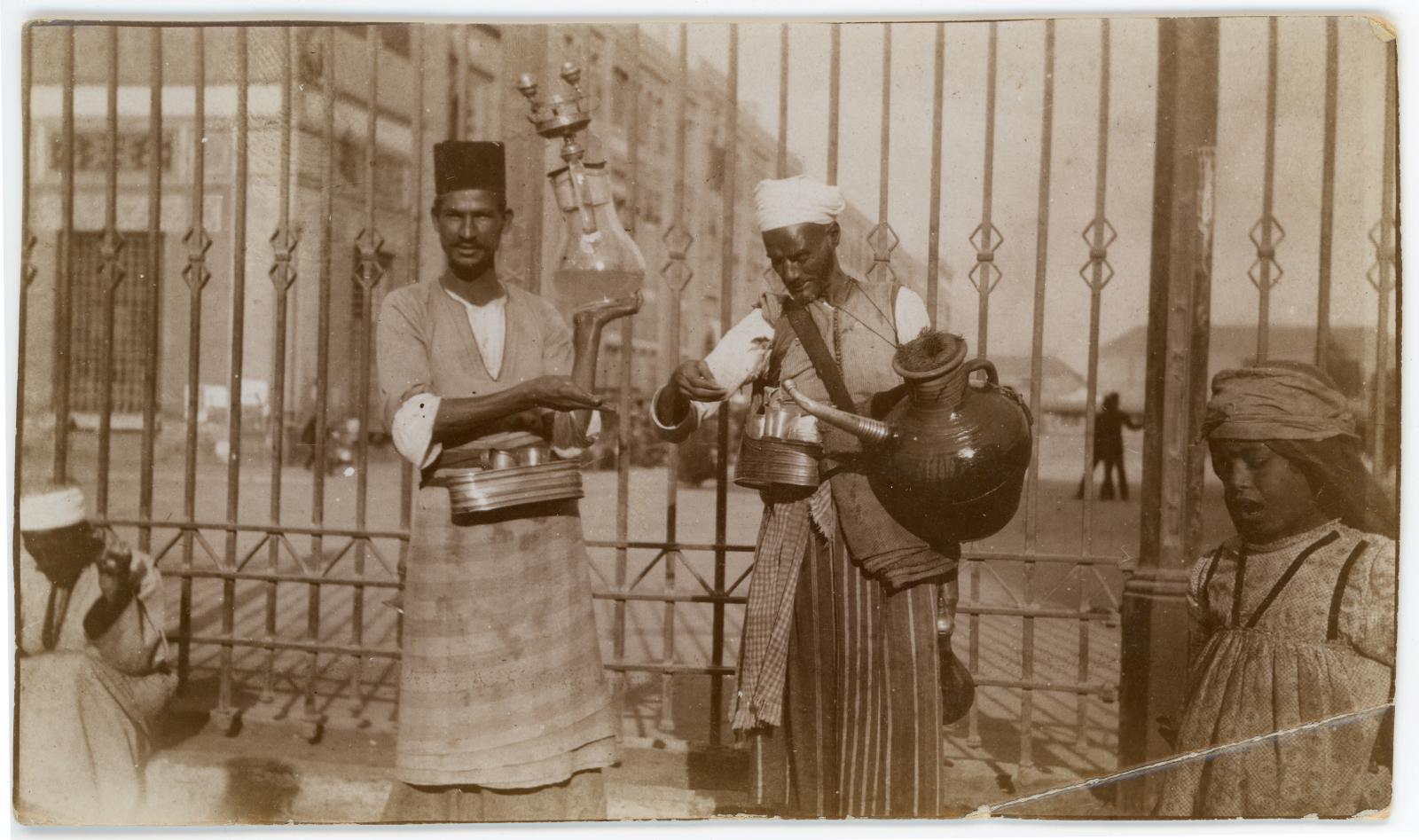 Photo showing 2 Egyptian street vendors selling lemonade on a street in Cairo.