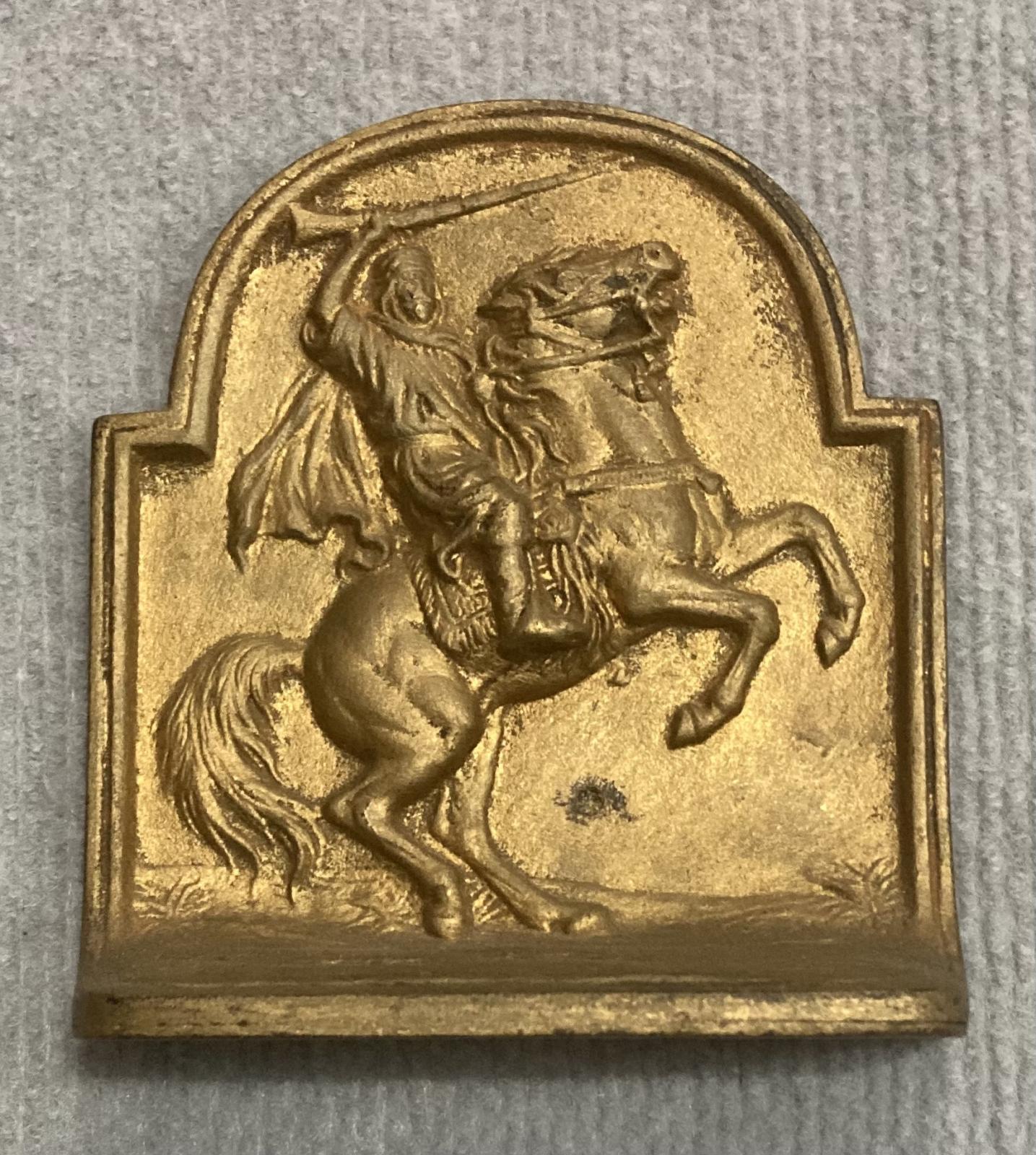 Painted metal book end featuring Lawrence of Arabia - view from above