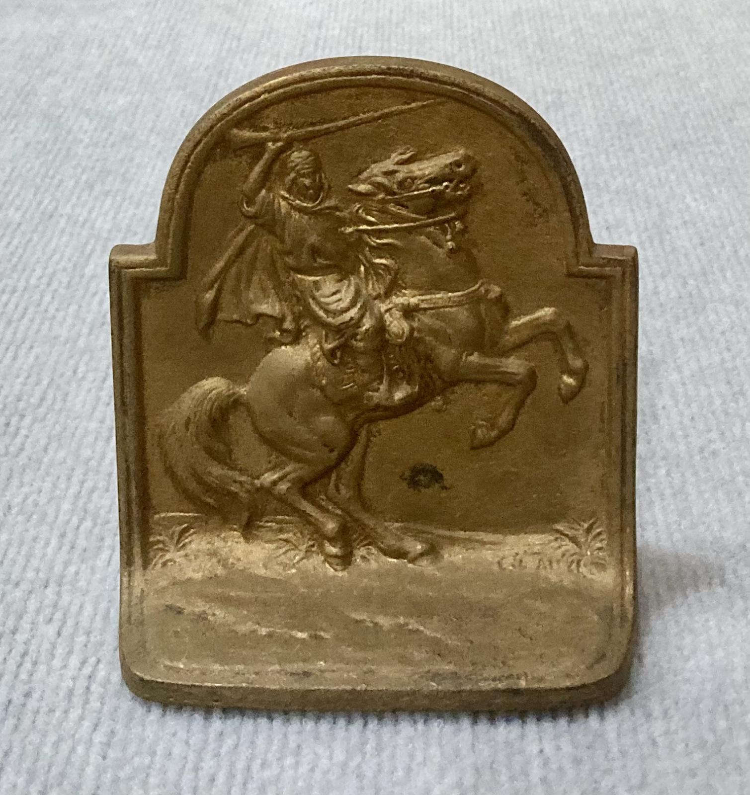 Painted metal book end featuring Lawrence of Arabia