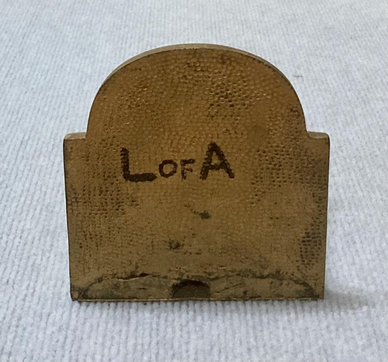 Painted metal book end featuring Lawrence of Arabia - back view