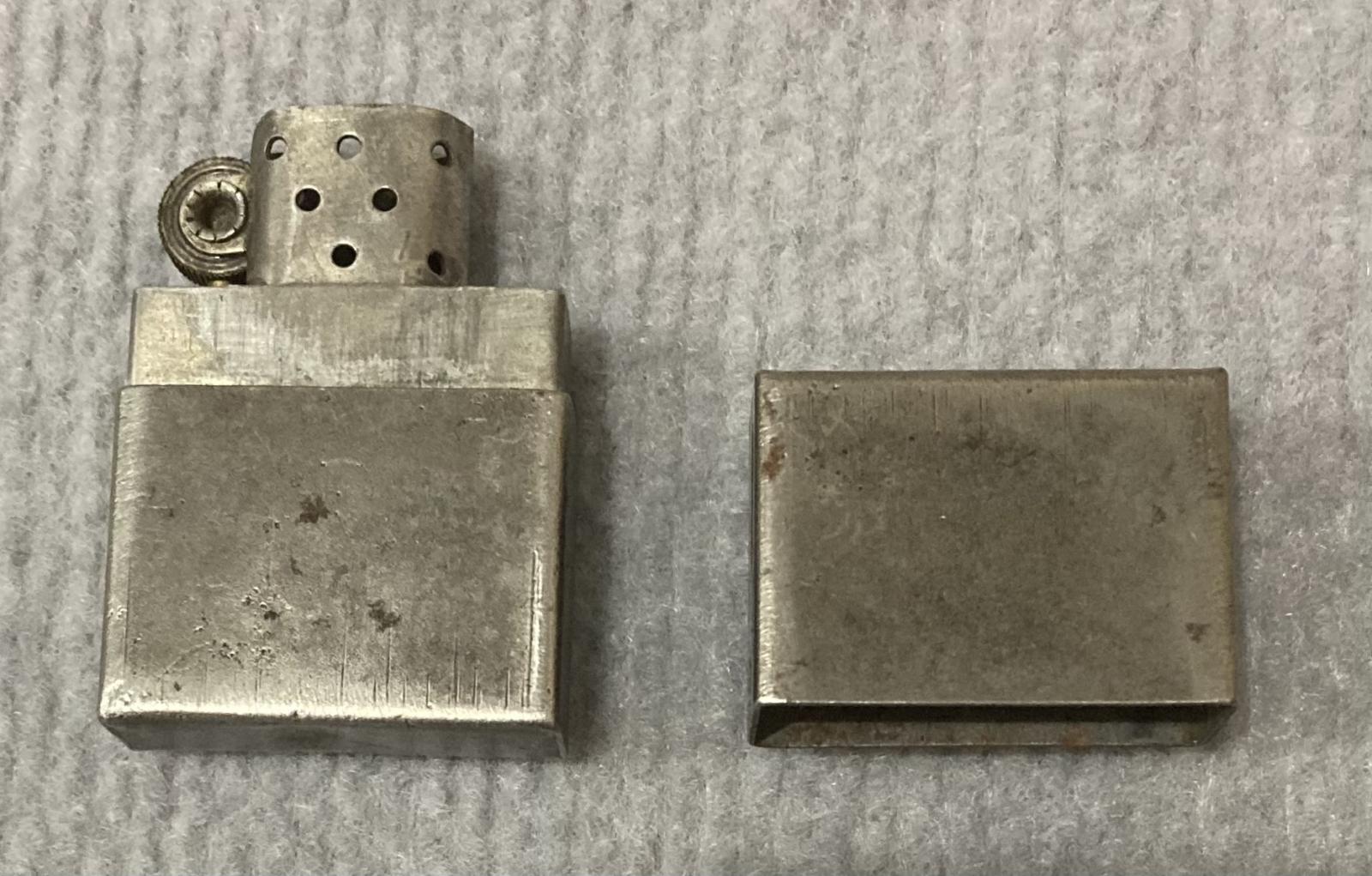 Metal lighter with attached rank badge and coin - lid removed reverse