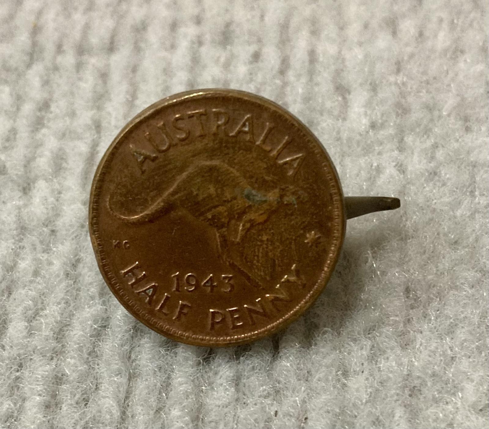 Miniature tea kettle made from Australian coin - view from below