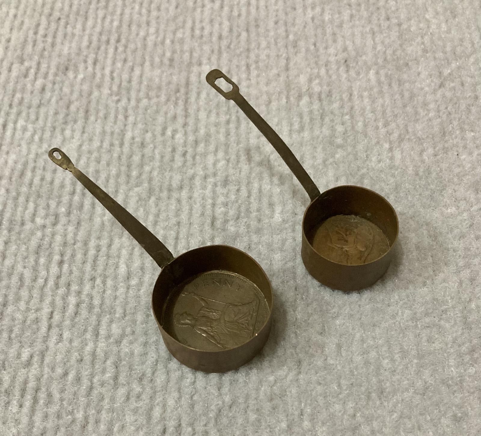 Miniature saucepans made from Australian coins 