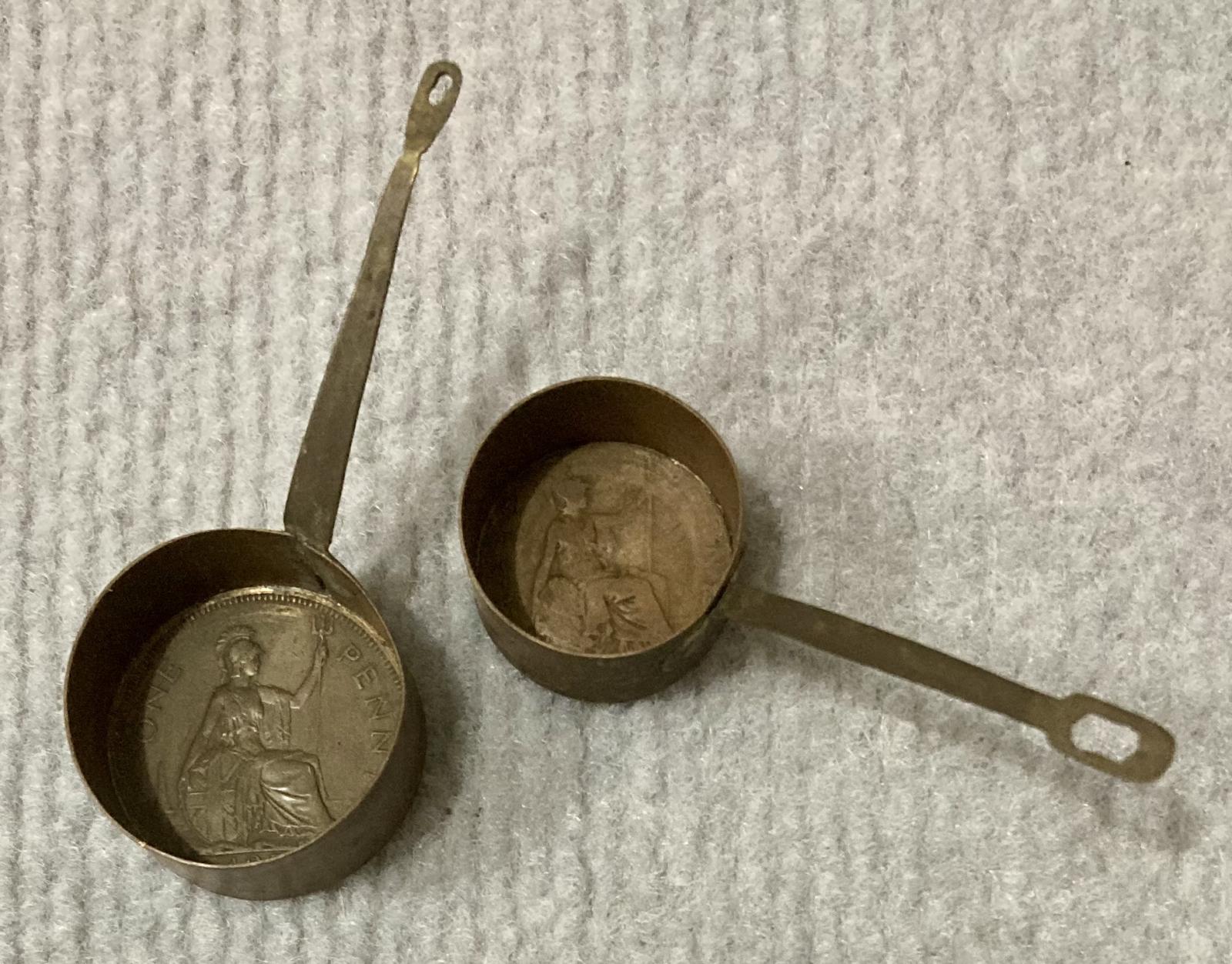 Miniature saucepans made from Australian coins 