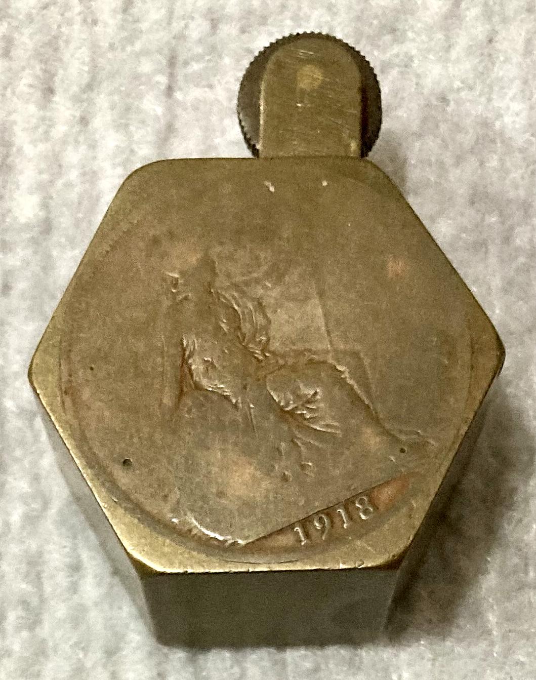 WWI era metal lighter decorated with two coins - side view from above