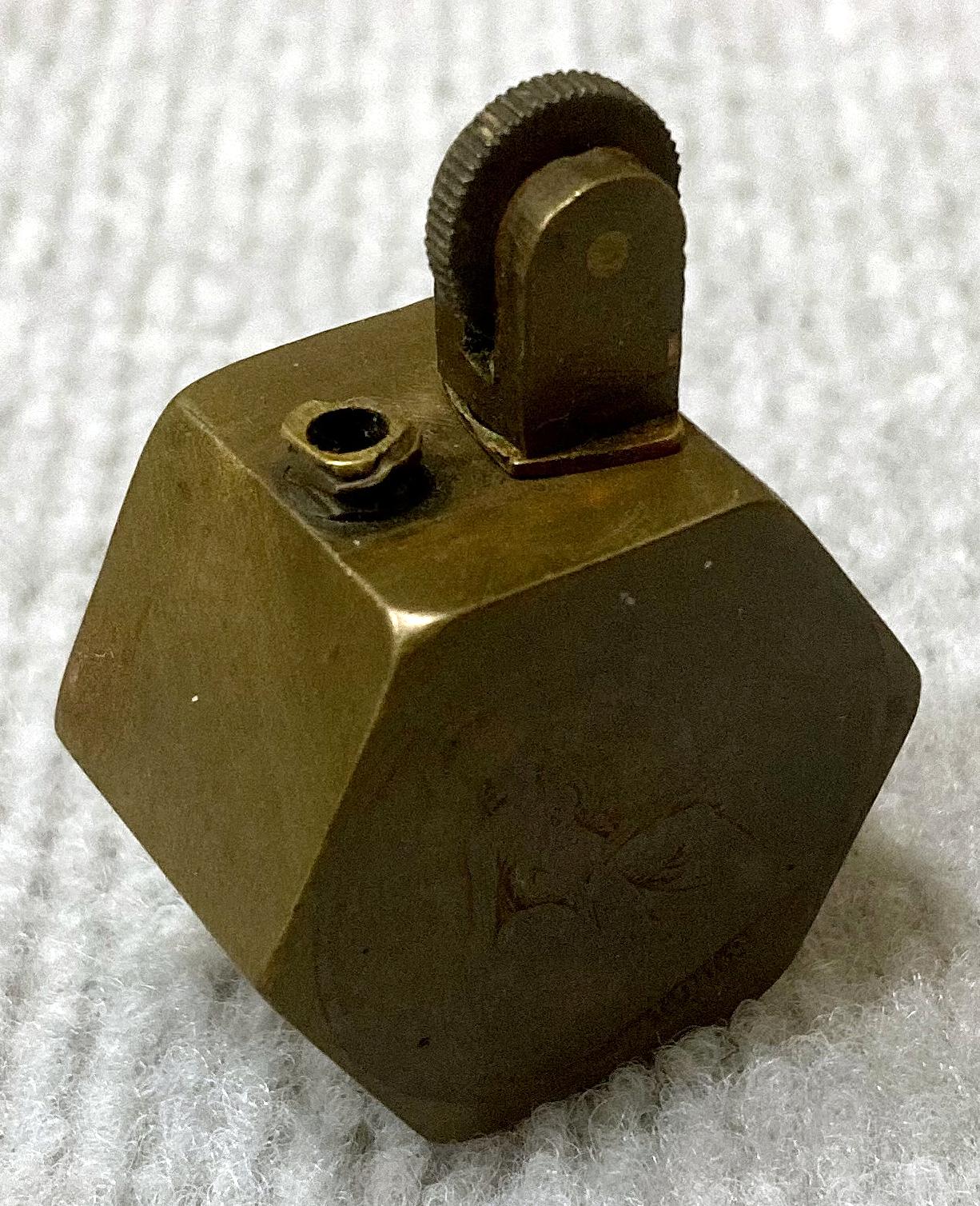 WWI era metal lighter decorated with two coins