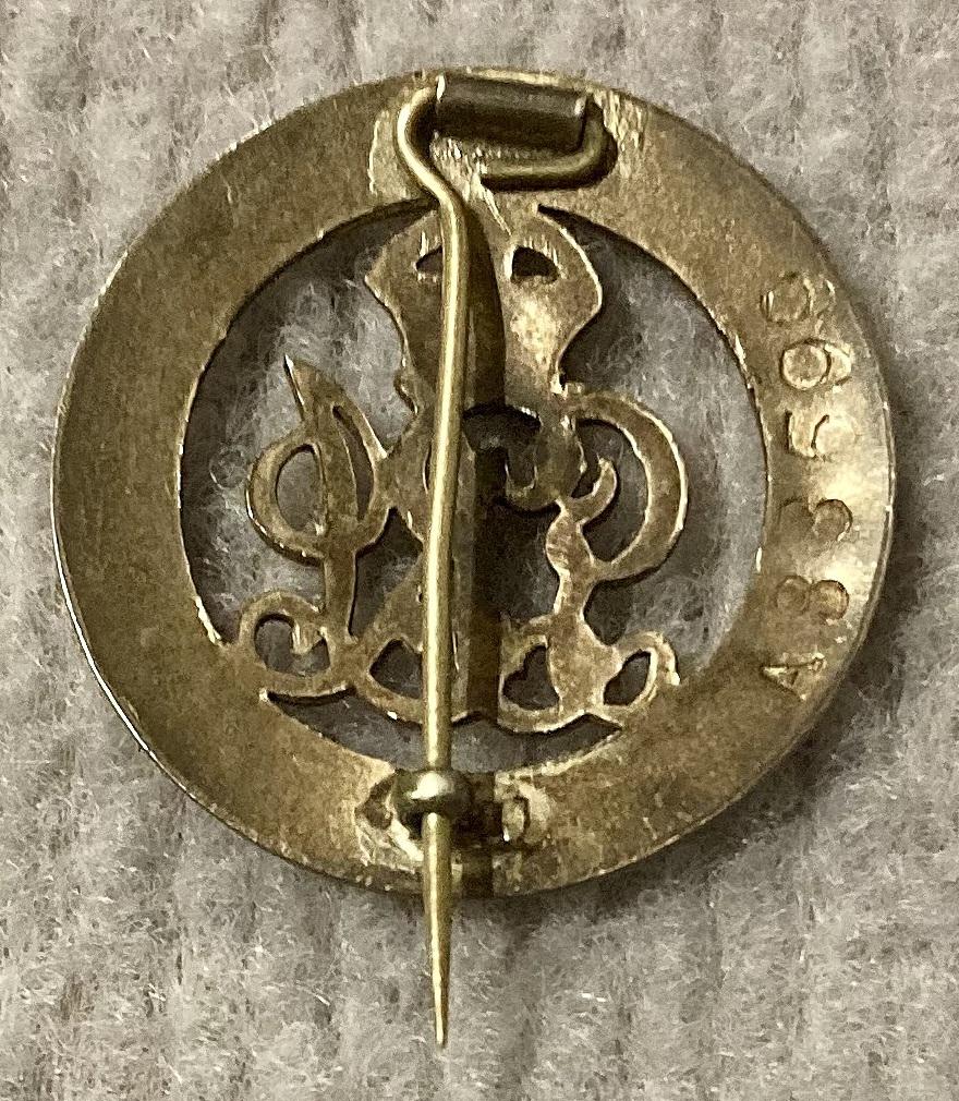 Reverse of  British Empire Silver War Badge for services rendered