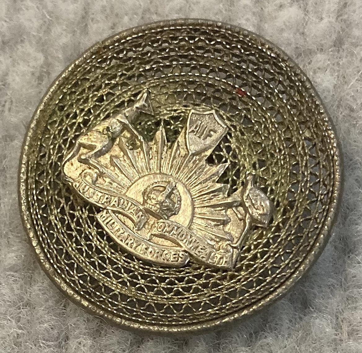 Other angled view of WWI A.I.F. sterling silver filigree sweetheart Rising Sun badge