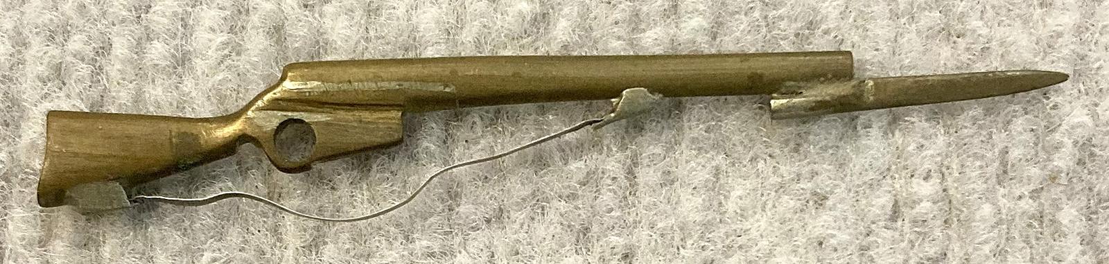 Miniature brass rifle with bayonet and sling