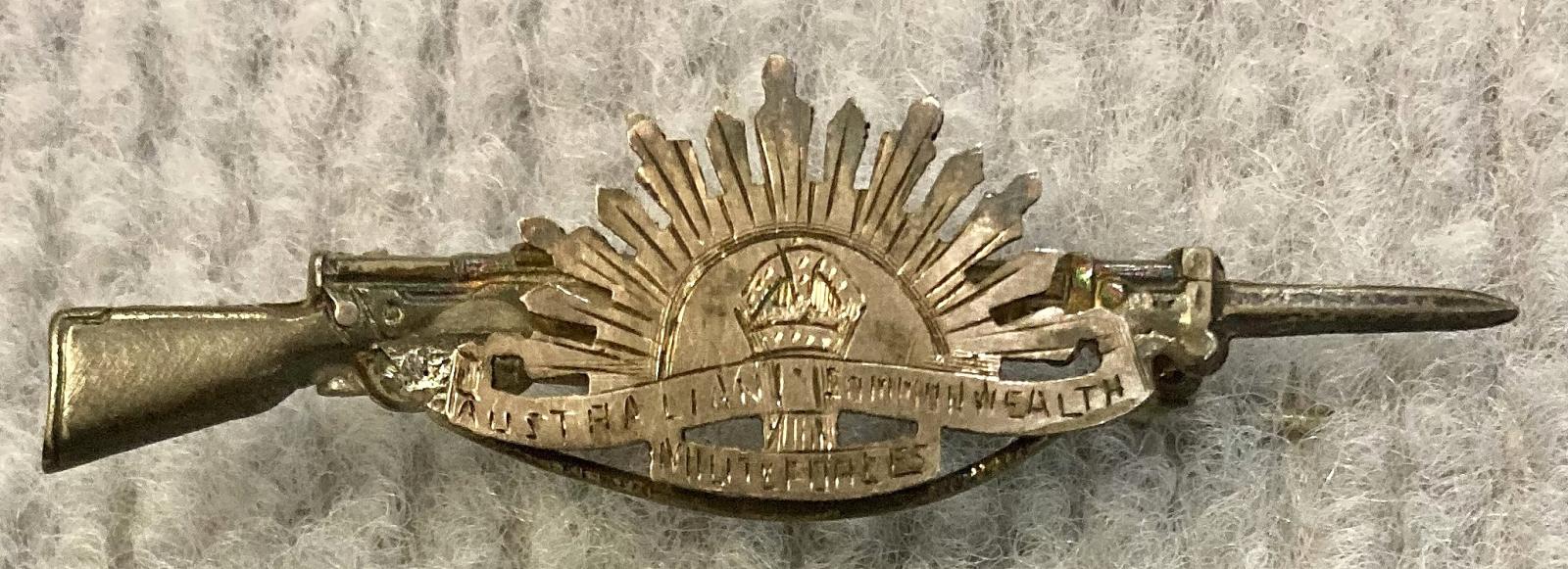 Sweetheart brooch with Rising Sun badge attached to rifle and bayonet