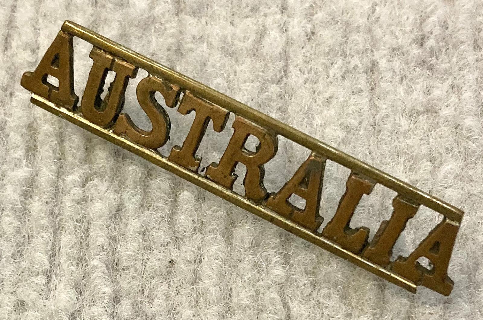 Angled view of straight Australia metal shoulder title