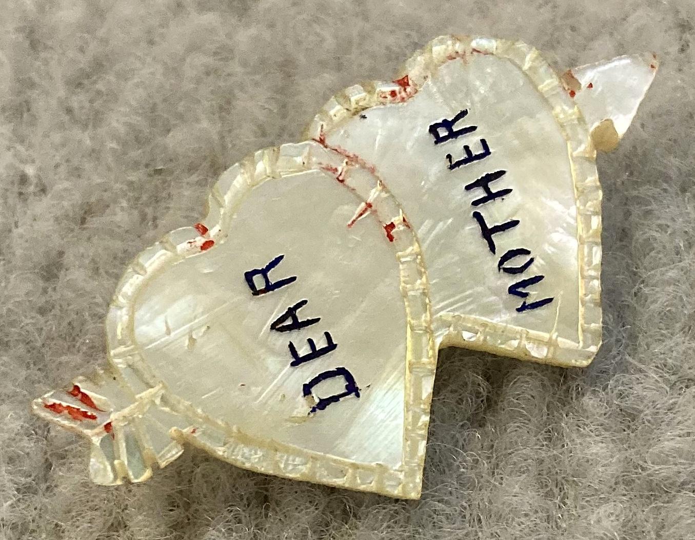 Angled view of mother of pearl hearts and arrow sweetheart brooch for 'Dear Mother'