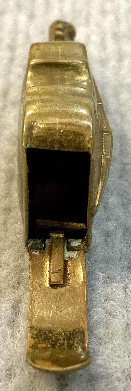 Antique brass vesta case in shape of violin with cover open, end view