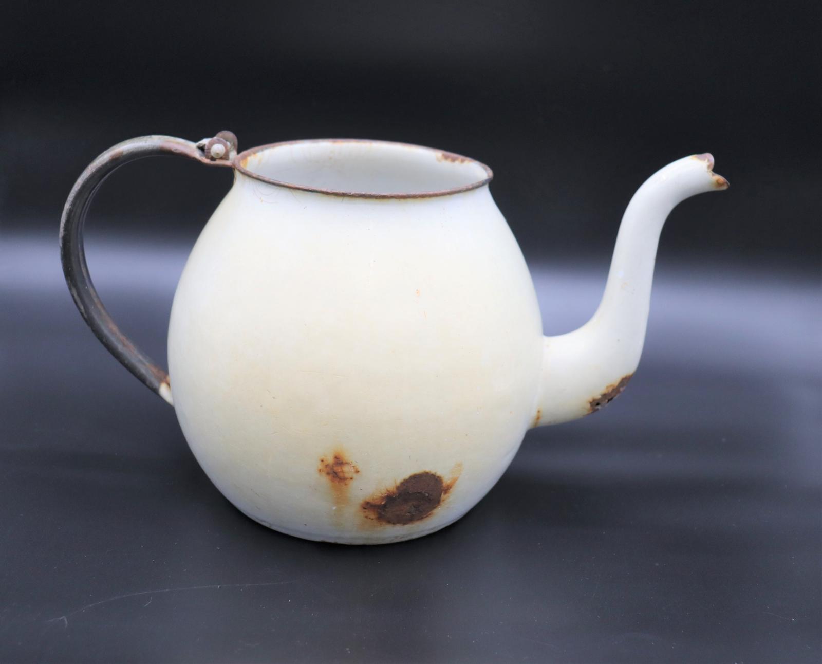 white metal teapot