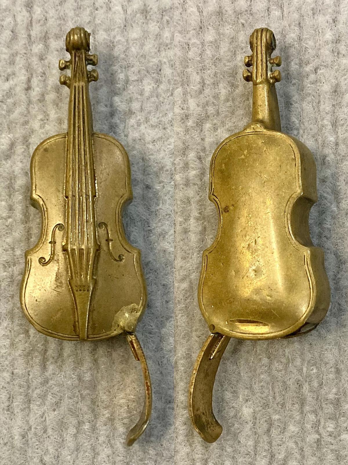 Antique brass vesta case in shape of violin showing back and front with cover open