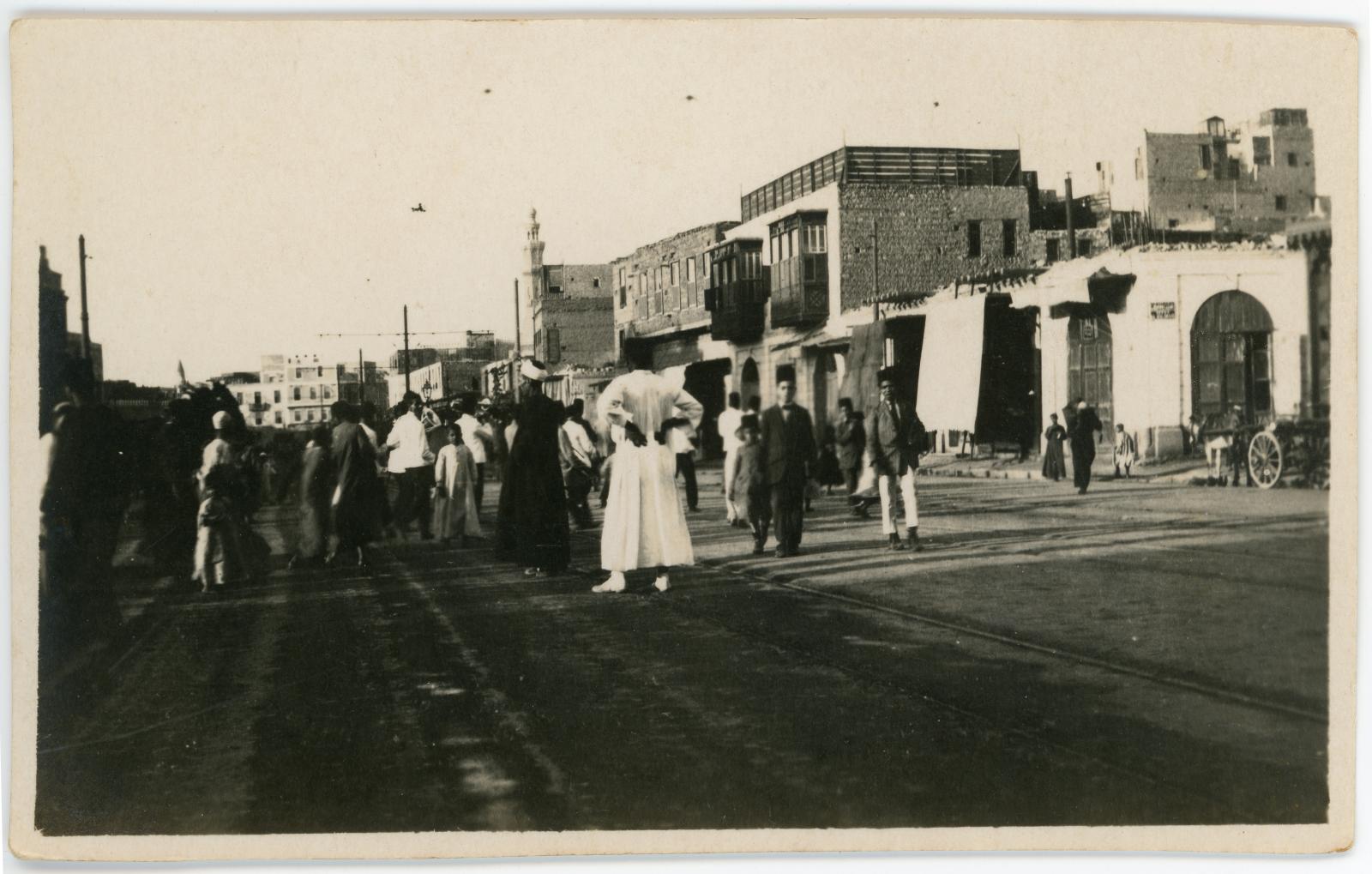 Group of local males, adult and children on a street in Cairo.
