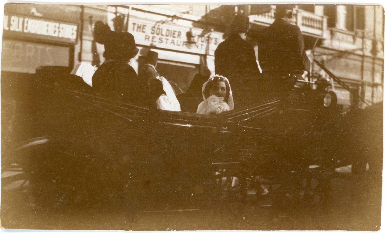 Photo showing Bridesmaids travelling in horse drawn carriage in Cairo.