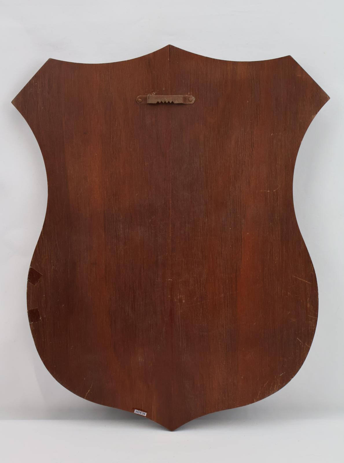 Reverse of plaque with hanging hook at the top