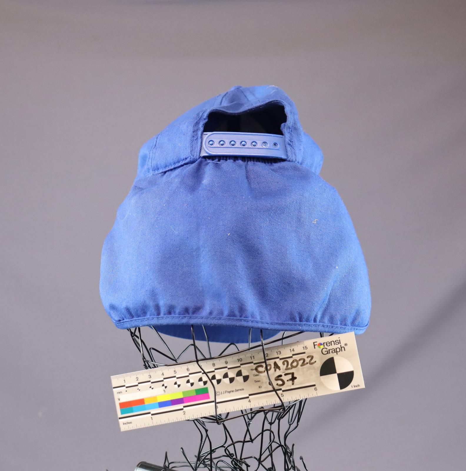 back of blue cap with fabric flap to cover back of neck