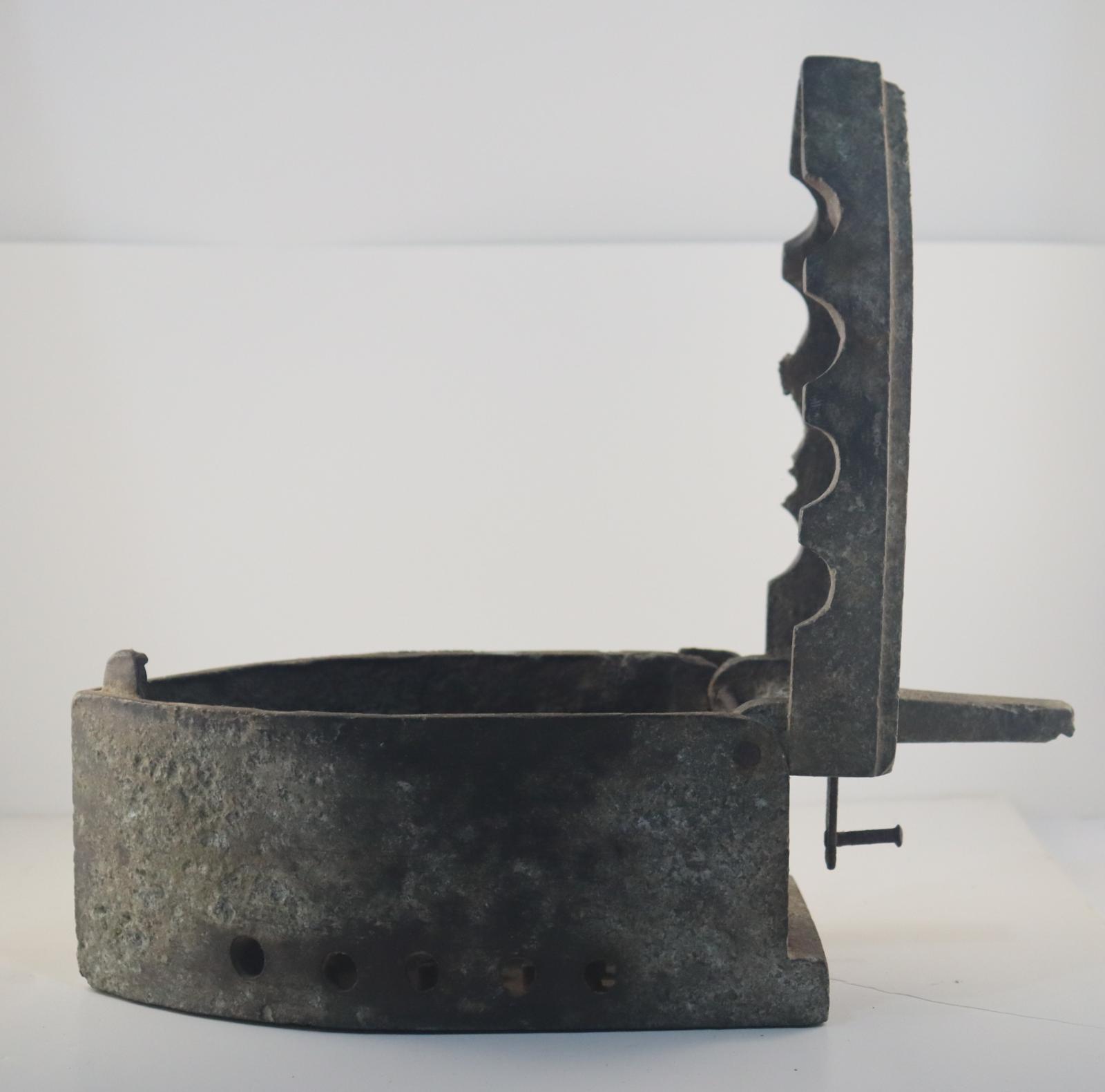 Side view of open Box Iron