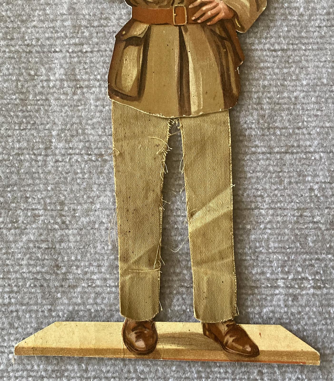 Close-up of bottom half of WWI era paper doll of British Army Officer 