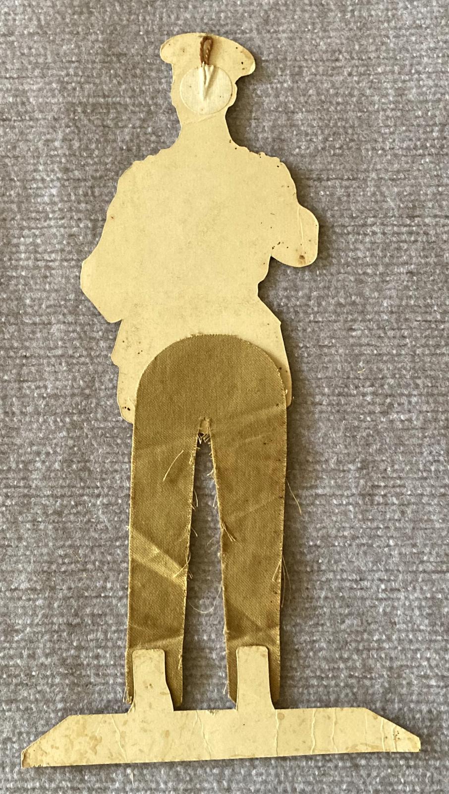 Reverse of WWI era paper doll of British Army Officer made from card and cloth