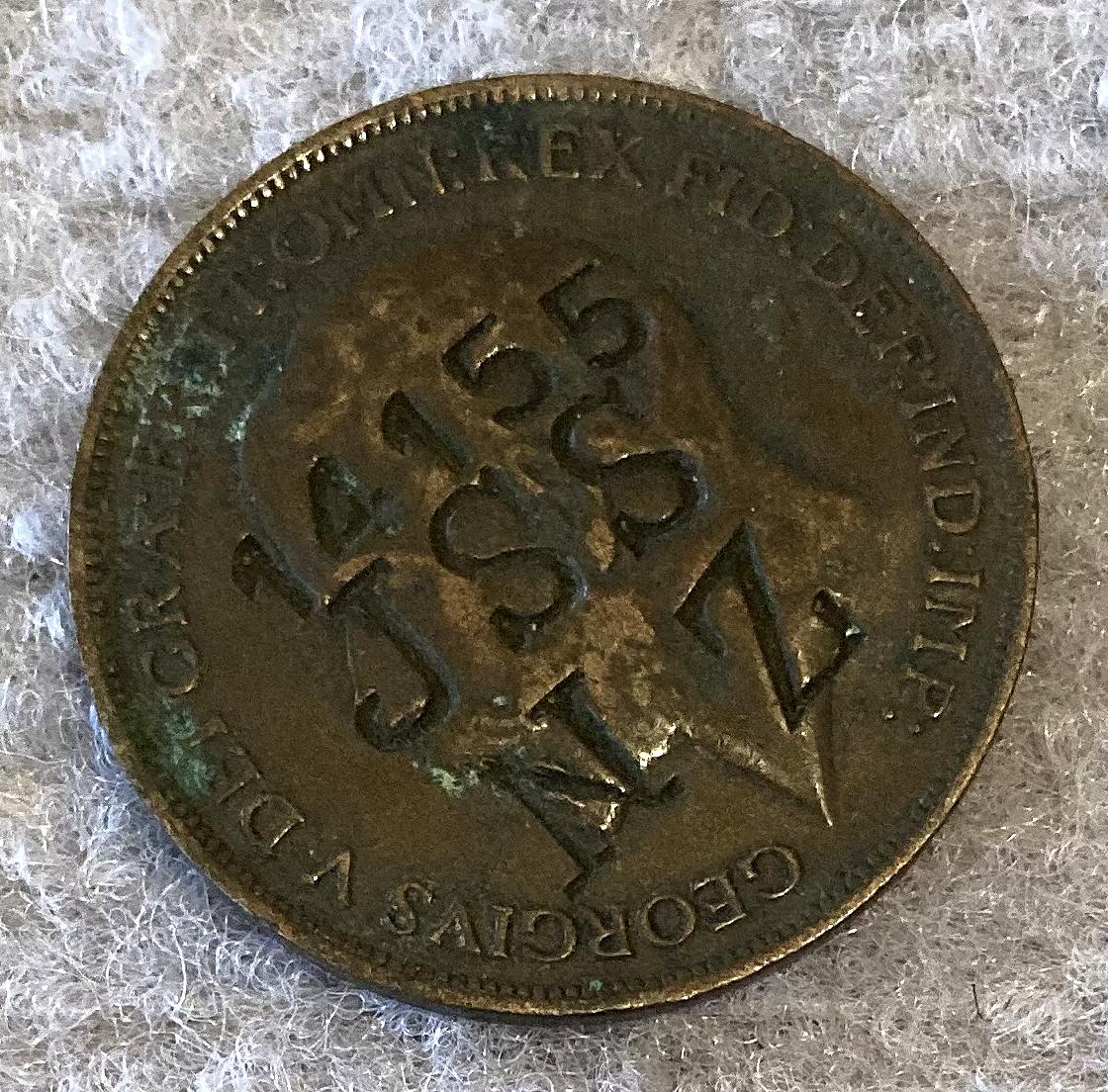Angled view of WWI identity disc made from a coin for John Stephen Shimmin