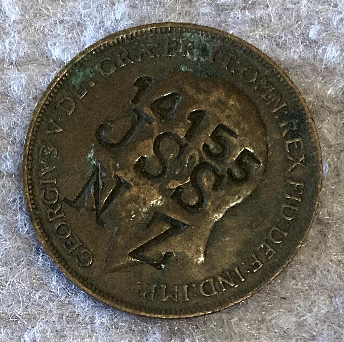 Other angled view of WWI identity disc made from a coin for John Stephen Shimmin