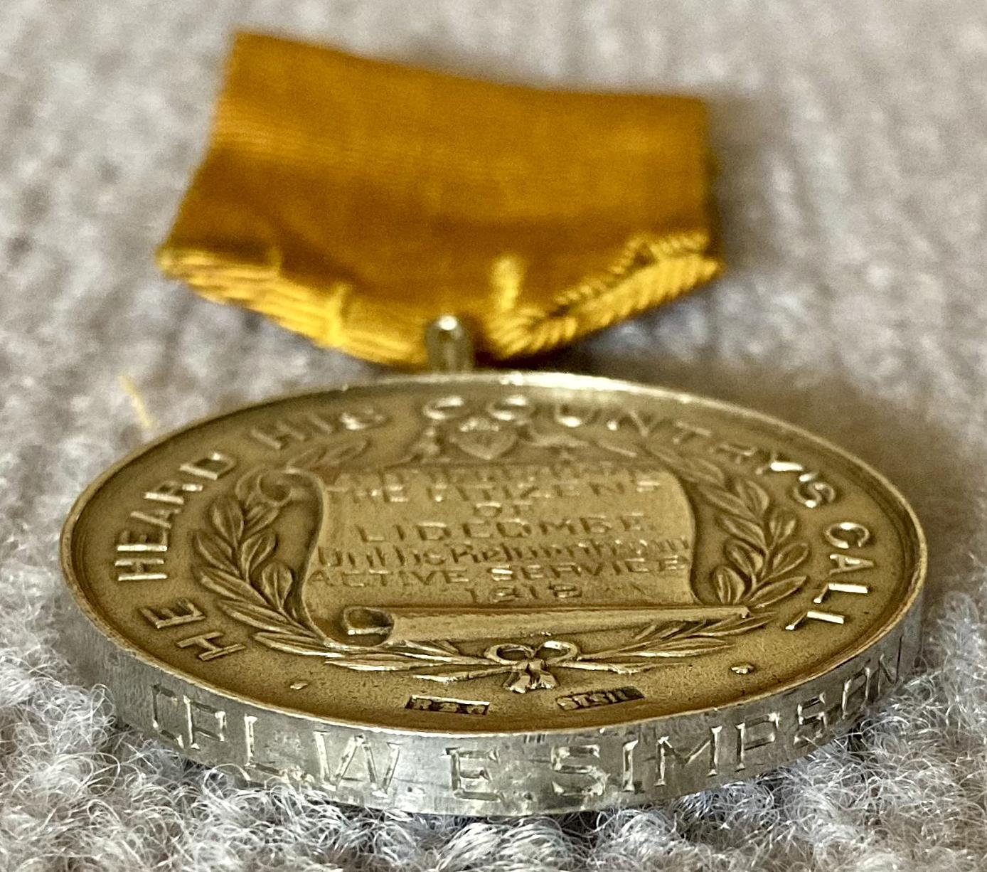 End view of Welcome Home presentation medal from the Citizens of Lidcombe showing engraved name