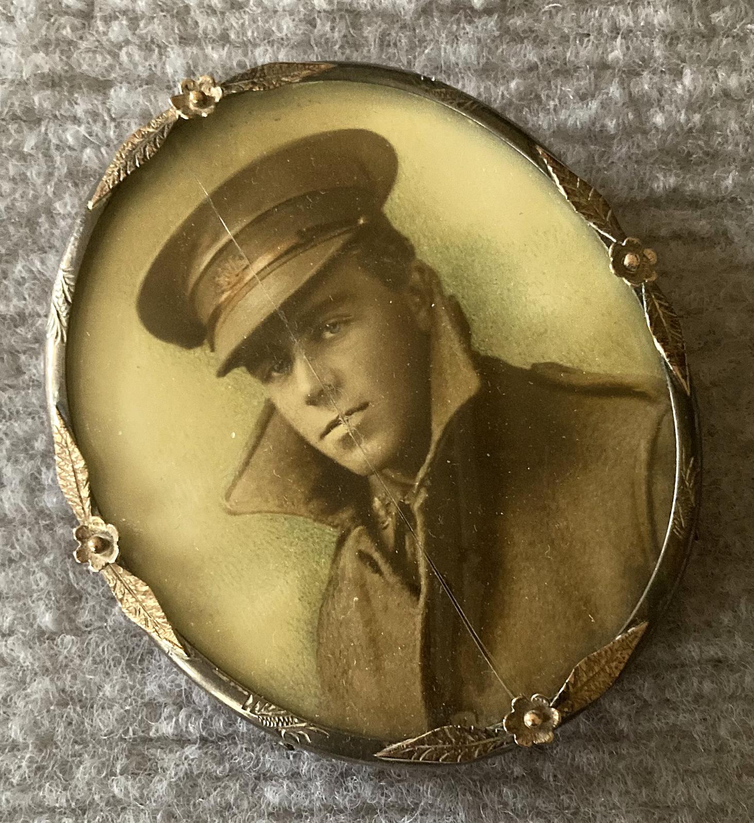 Angled view of miniature hand tinted portrait of WWI Australian soldier in silver and gold frame