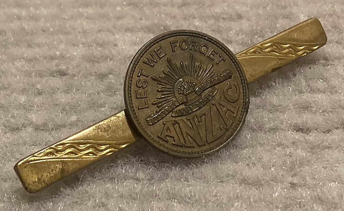 Angled view of 'Lest we forget ANZAC' tie or lapel pin
