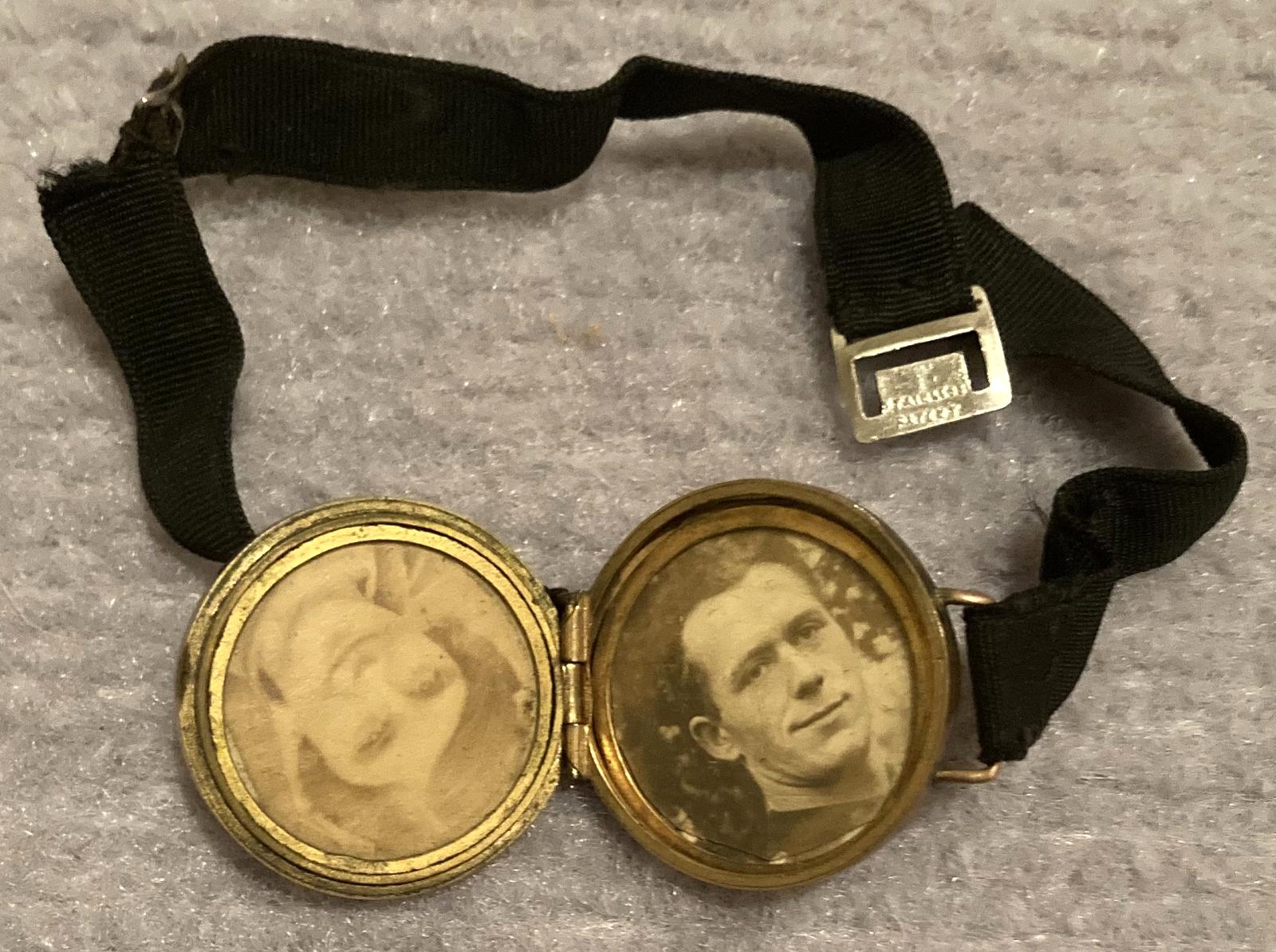 Birmingham Battalion lapel badge converted to photo locket showing photos inside