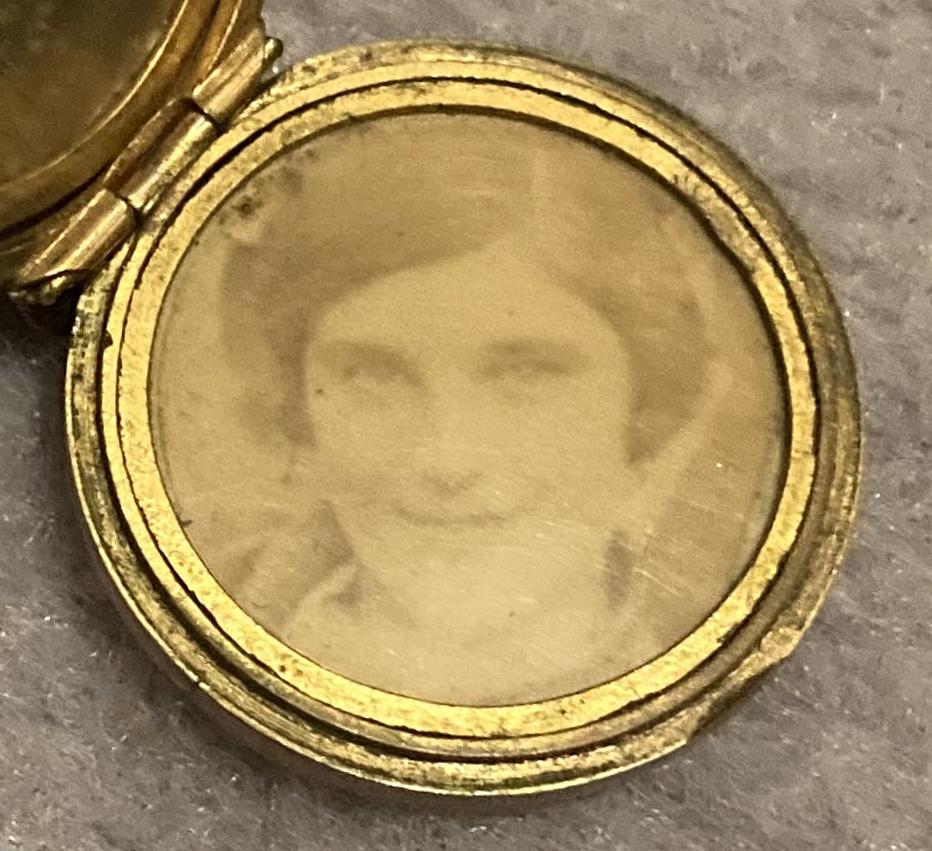Close-up of Birmingham Battalion lapel badge converted to photo locket showing woman
