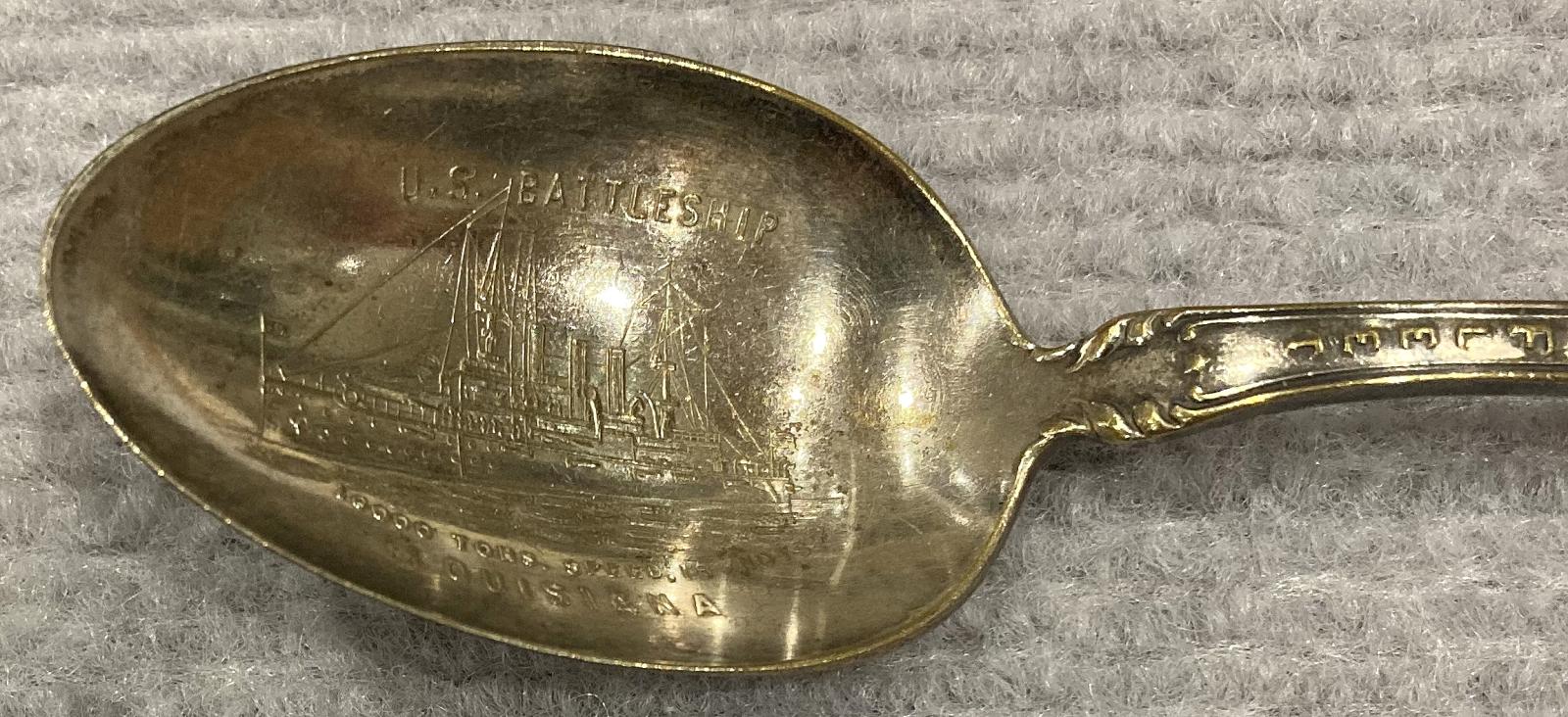 Close-up of spoon bowl showing U.S. Battleship Louisiana