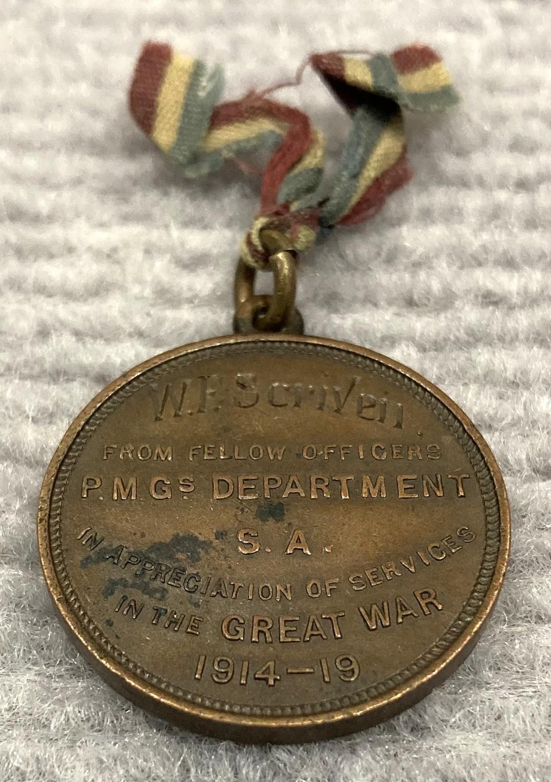 Oblique view of War Service medal from South Australian P.M.G. Department presented to Walter Frederick Scriven