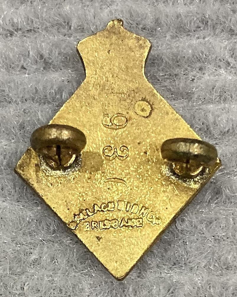 Reverse of Civil Defence Queensland Messenger (M) badge 
