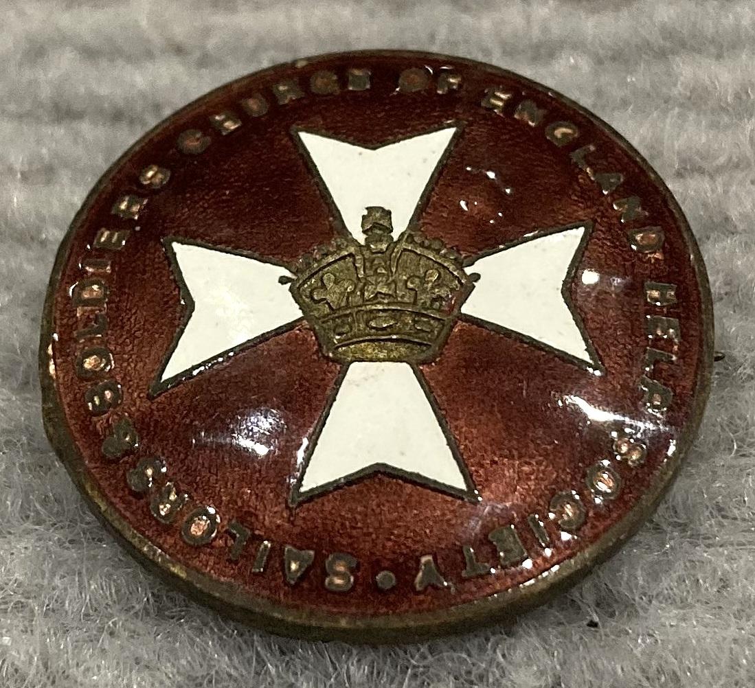 Oblique view of Sailors & Soldiers Church of England Help Society enamel badge