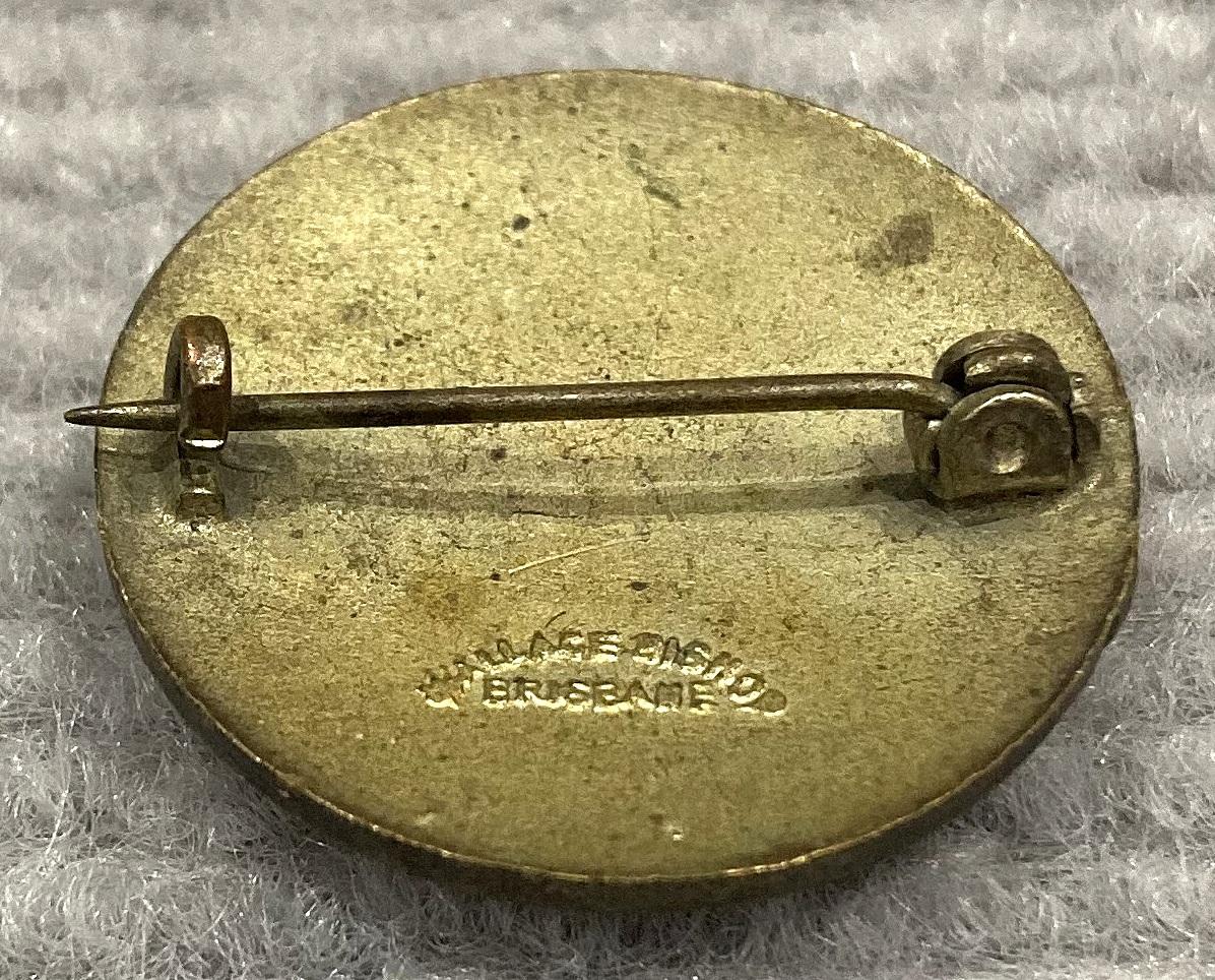 Oblique view of reverse of Sailors & Soldiers Church of England Help Society enamel badge