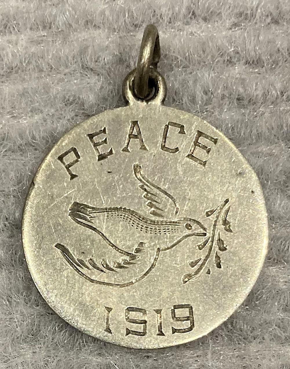 Silver Peace medallion featuring dove carrying olive branch - 1919