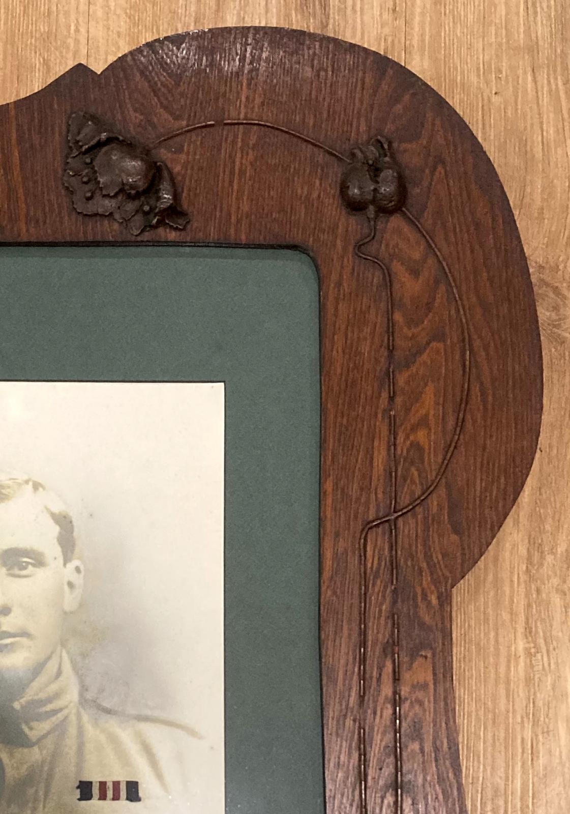 Close-up of decorative timber work on Art Nouveau frame