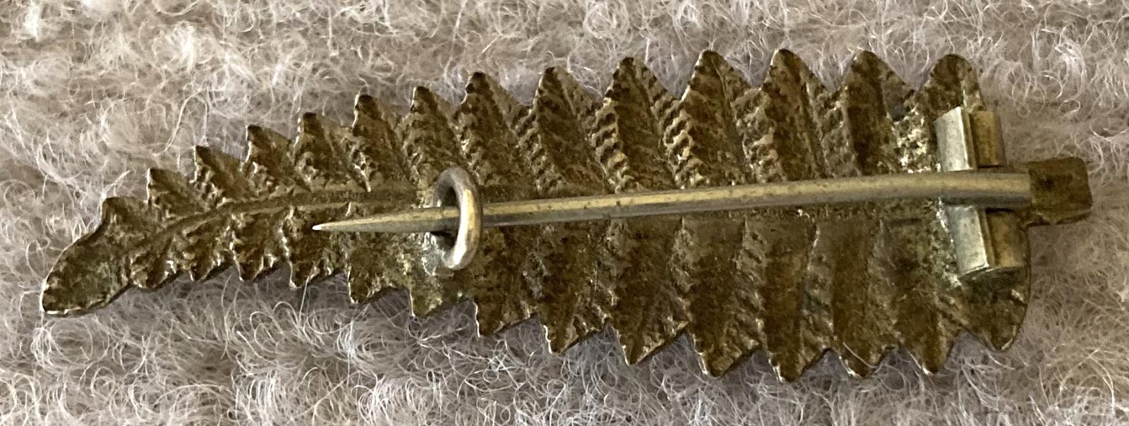 Reverse of WWI era NZ silver fern sweetheart brooch with name plate