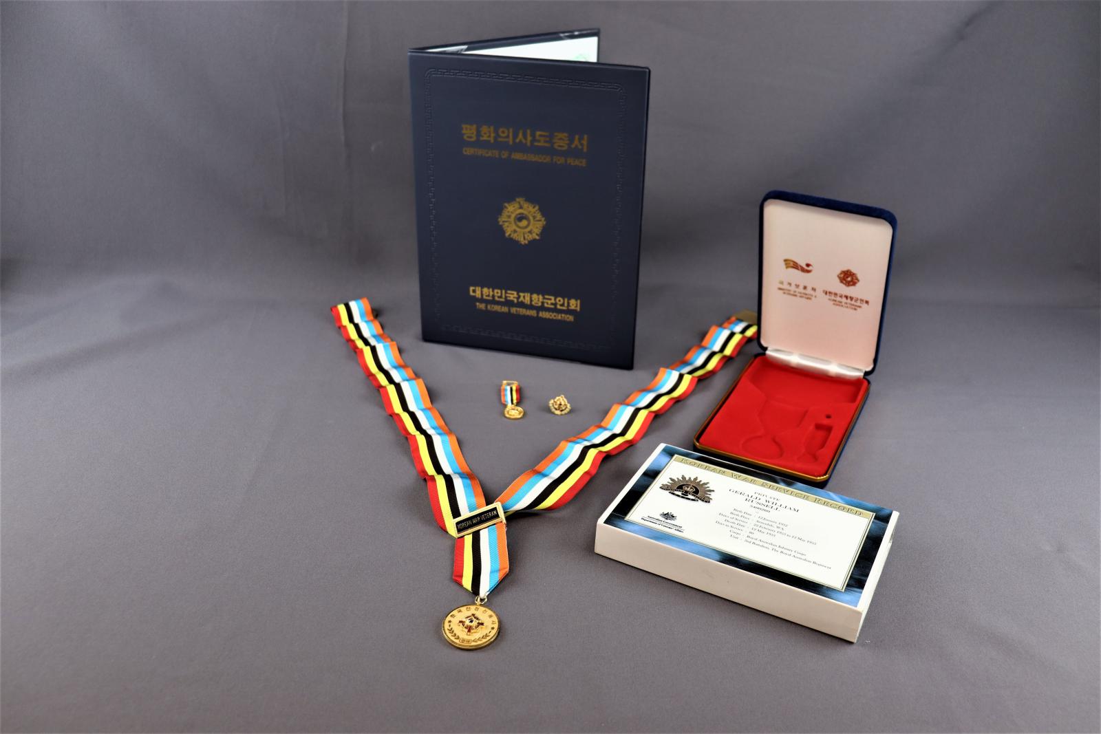 Ambassador for Peace medal, Lapel Pin, Smaller medal, Folder, Certificate and Case.