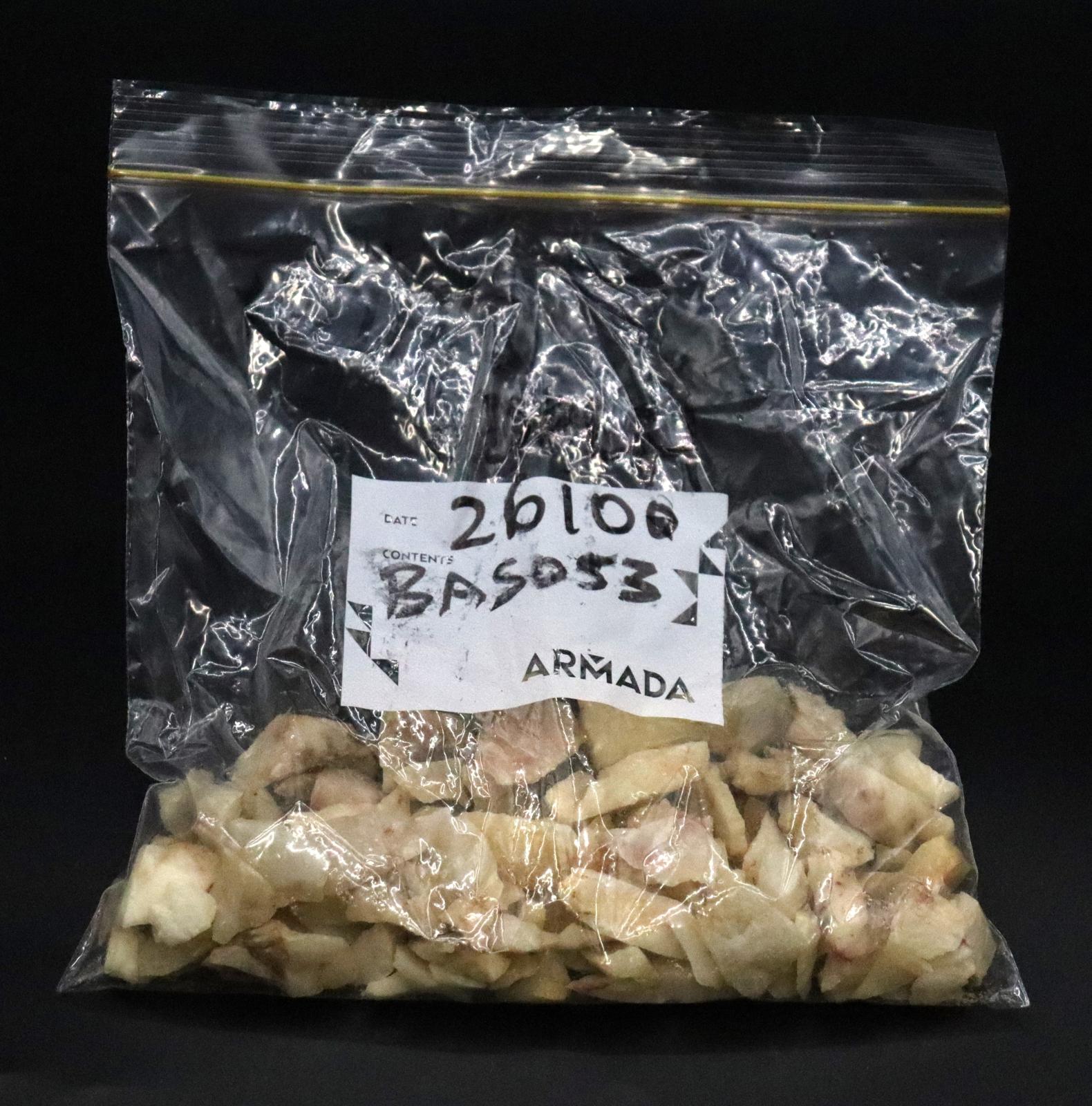 The bag is half filled with a quantity of white coloured stones. 