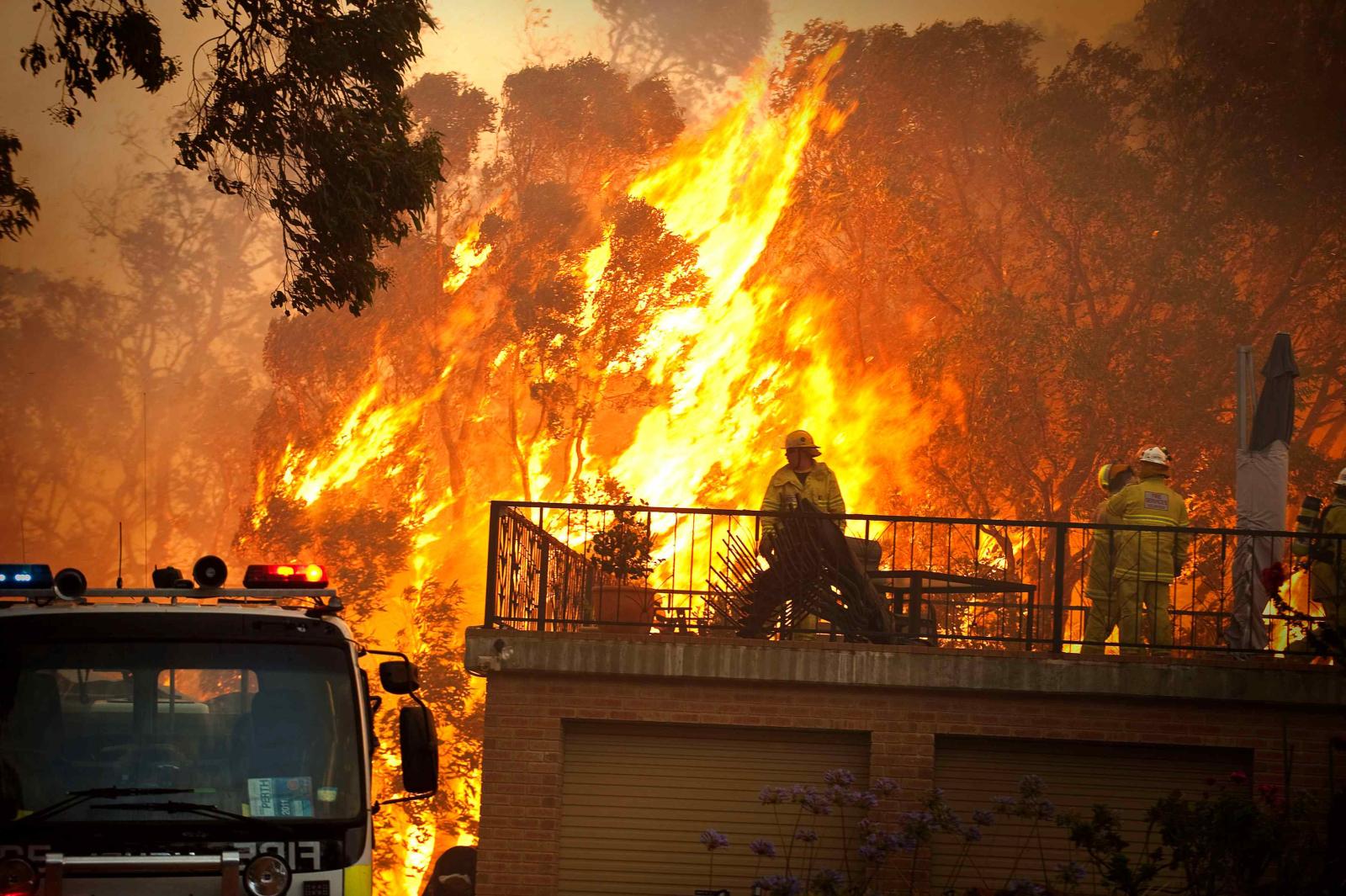 Image of a house and a fire about to engulf it.