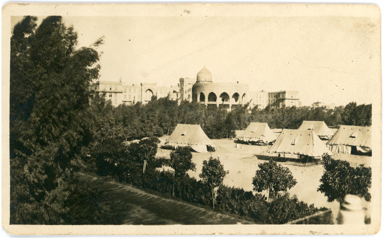 Photo showing tents of the No.3 Auxiliary Hospital, with the Heliopolis Palace Hotel in the background.