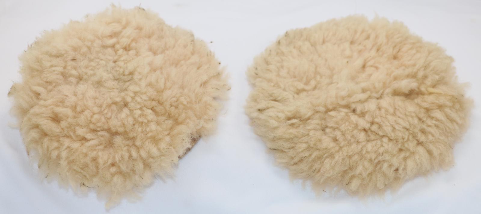 Wool attached to a circular piece of fabric. The wool is cream in colour and the backing fabric is a darker cream. There is a press stud in the centre for joining to the machine.