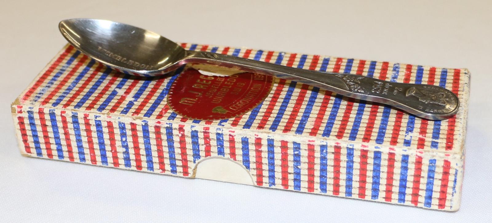 Coronation spoon on top of red, white and blue coronation spoon box.