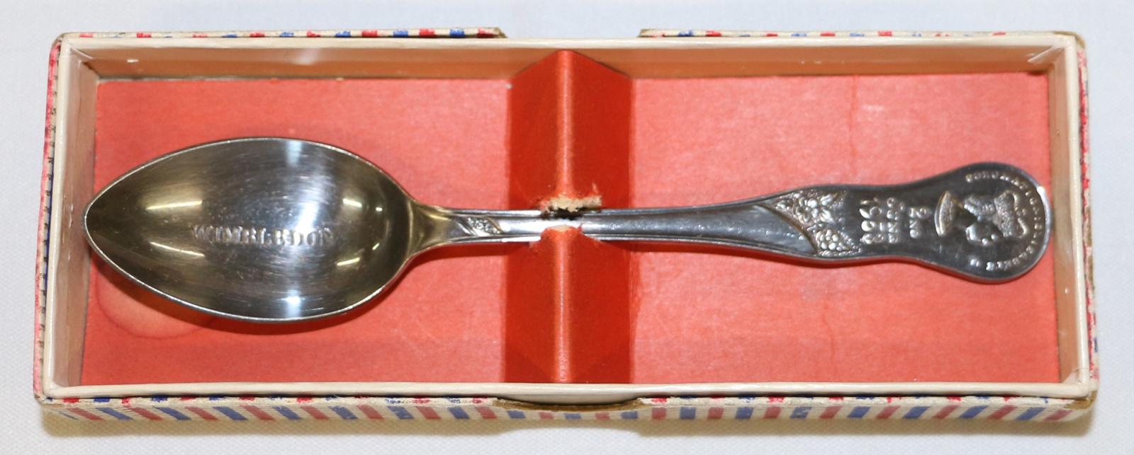 Coronation spoon inside spoon box, box has red base.