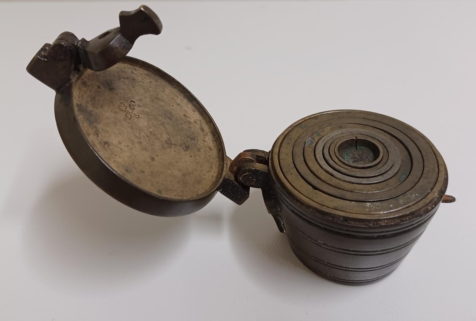 Brass case with weights