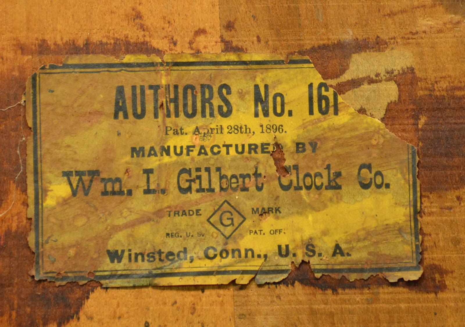 The makers sticker on the rear of a mantel clock